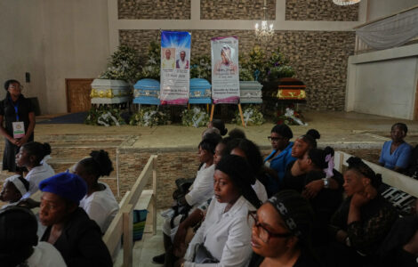 Mourners file into a church in Haiti where gangs killed dozens of people in latest rampage